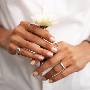 woman-showing-her-nail-art-fingernails-with-flower (1)